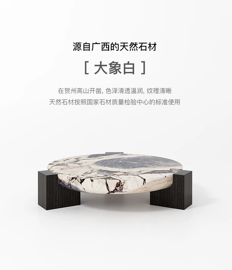 Marble round coffee table is luxurious, quiet and simple. Small apartment in living room, Italian minimalist designer furniture.