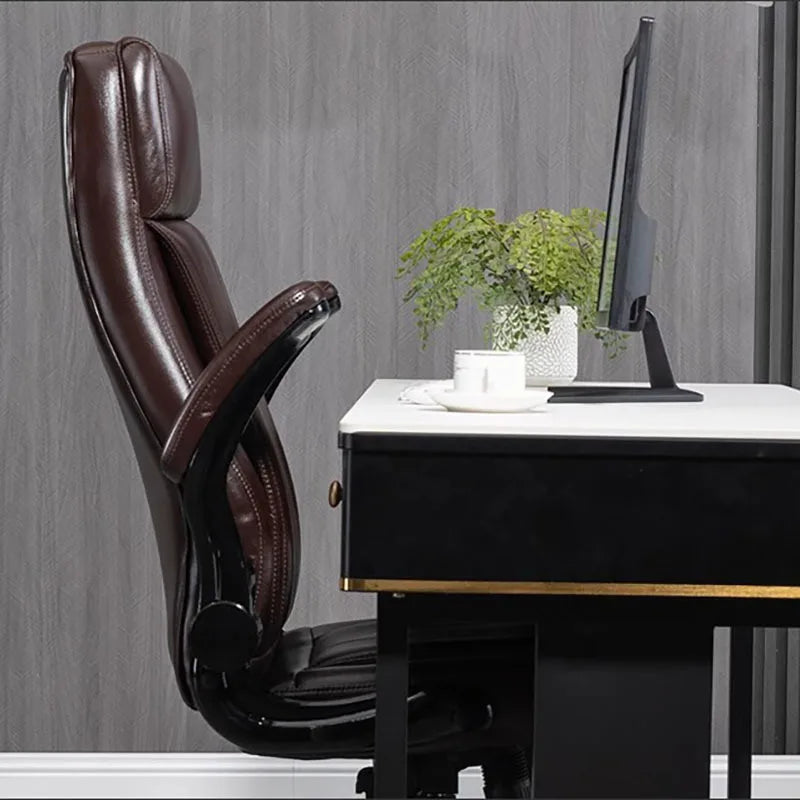 Luxury ergonomic office chair with swivel, cushion, and wheels.