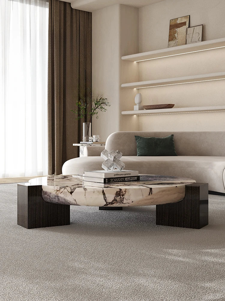 Marble round coffee table is luxurious, quiet and simple. Small apartment in living room, Italian minimalist designer furniture.